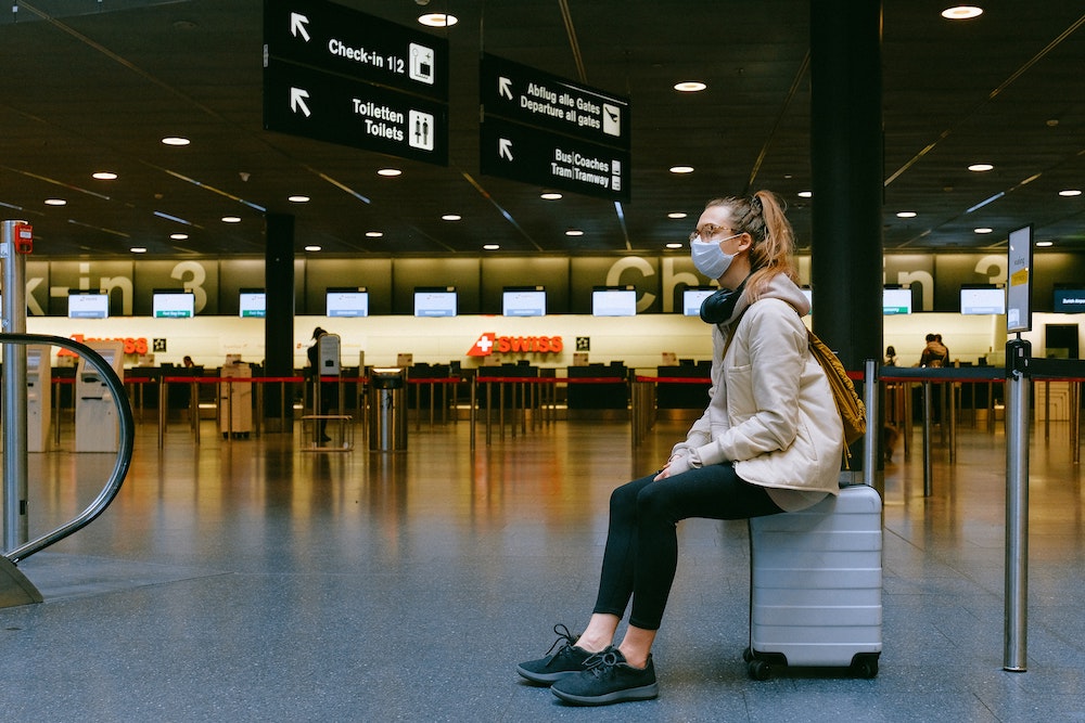 Tourist travelling safely on a journey paid for using Prommt